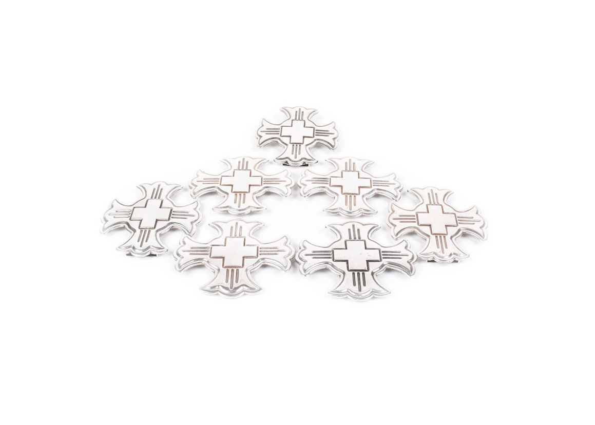 A Group of Six Silvertone Crosses with a Matching Cross Buckle for Adorning a Belt
