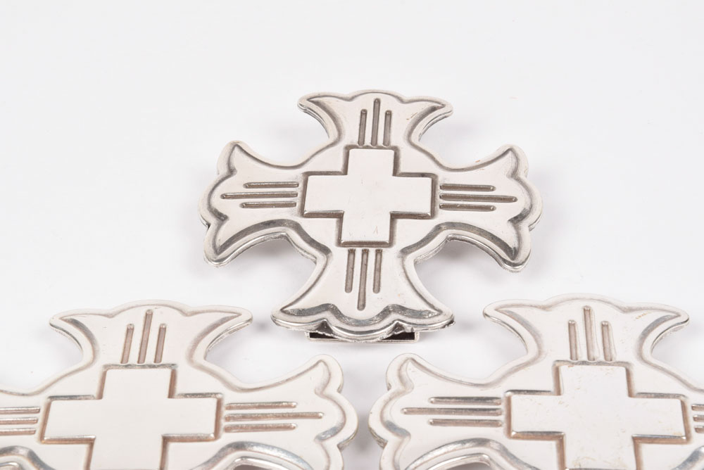 A Group of Six Silvertone Crosses with a Matching Cross Buckle for Adorning a Belt