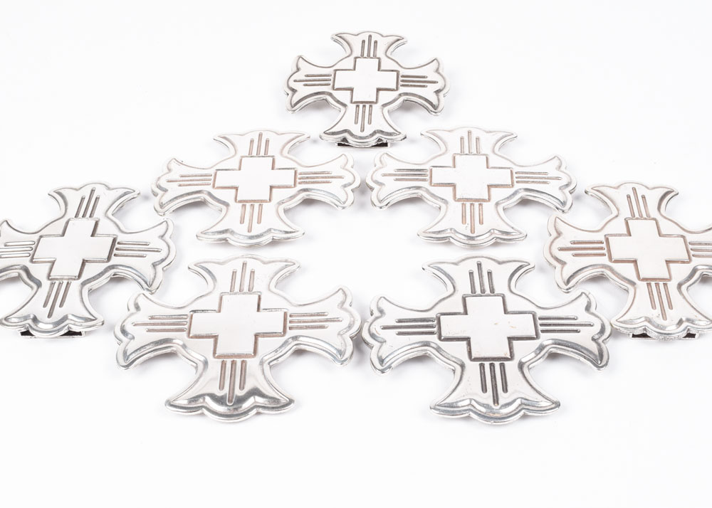 A Group of Six Silvertone Crosses with a Matching Cross Buckle for Adorning a Belt