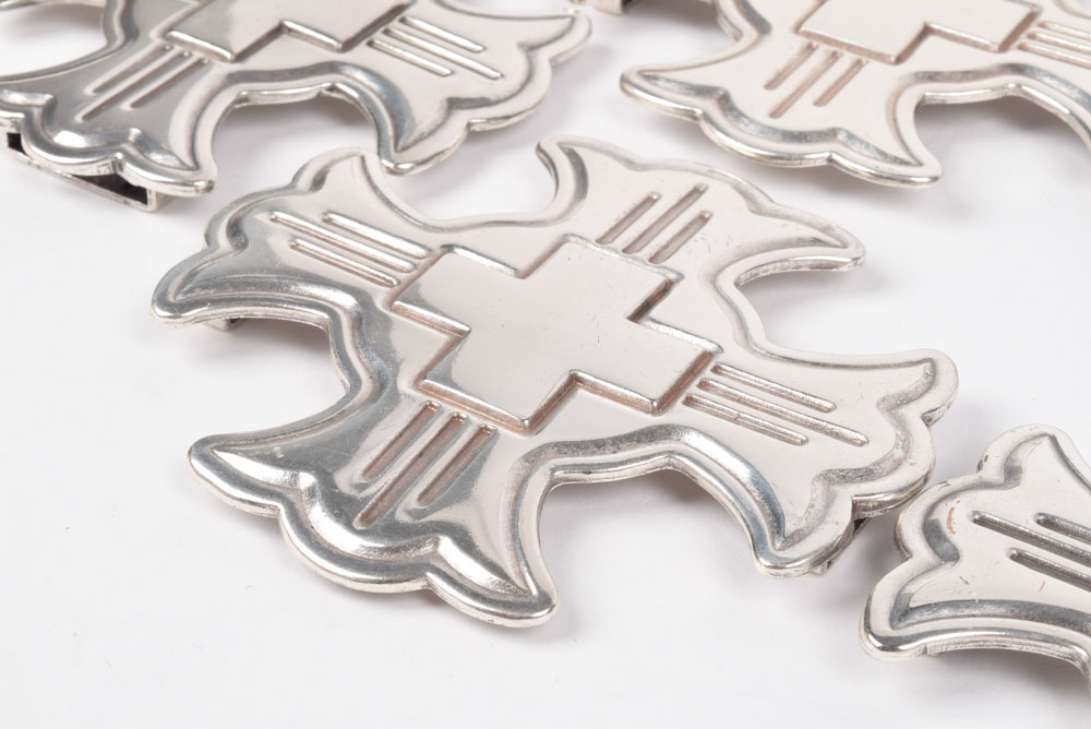 A Group of Six Silvertone Crosses with a Matching Cross Buckle for Adorning a Belt