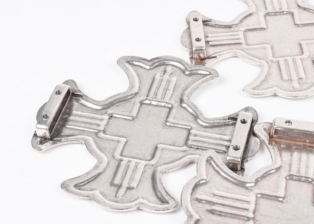A Group of Six Silvertone Crosses with a Matching Cross Buckle for Adorning a Belt