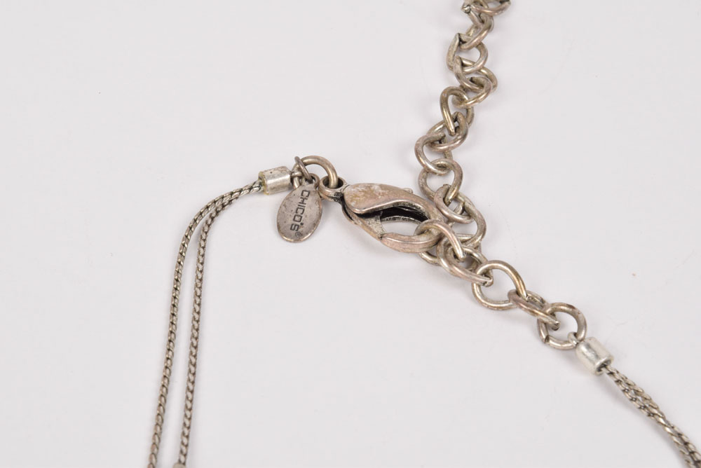 Collection of Costume Jewelry Including a Carved Shell Stretch Bracelet