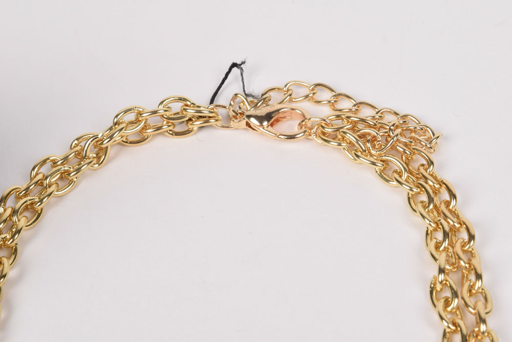 Collection of Costume Jewelry Including a Carved Shell Stretch Bracelet