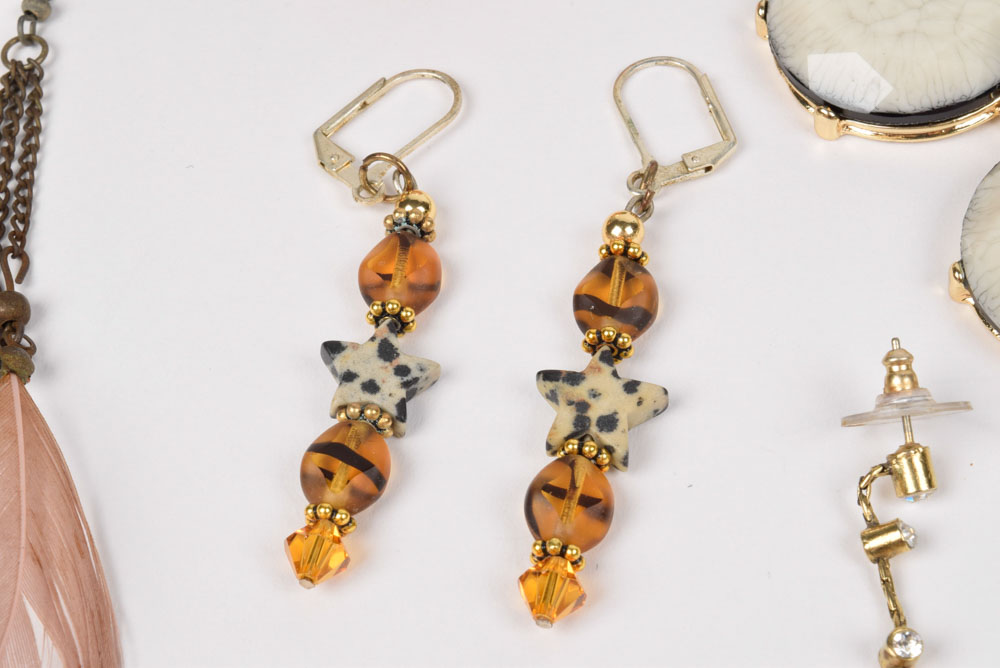 Collection of Costume Jewelry Including a Carved Shell Stretch Bracelet