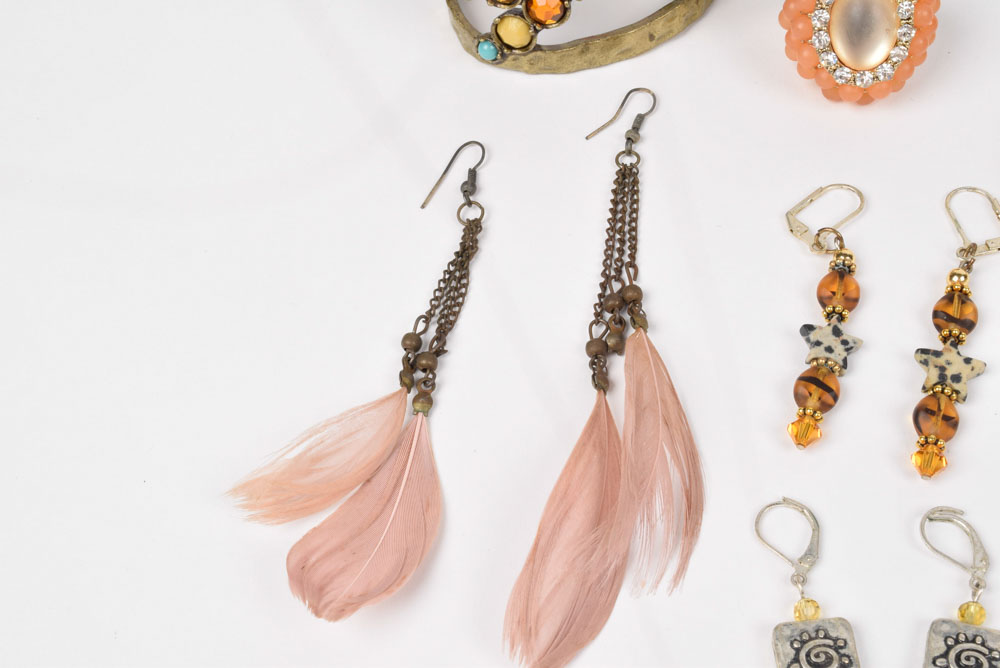 Collection of Costume Jewelry Including a Carved Shell Stretch Bracelet