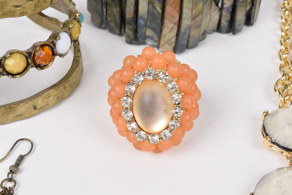 Collection of Costume Jewelry Including a Carved Shell Stretch Bracelet