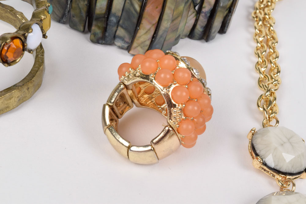 Collection of Costume Jewelry Including a Carved Shell Stretch Bracelet