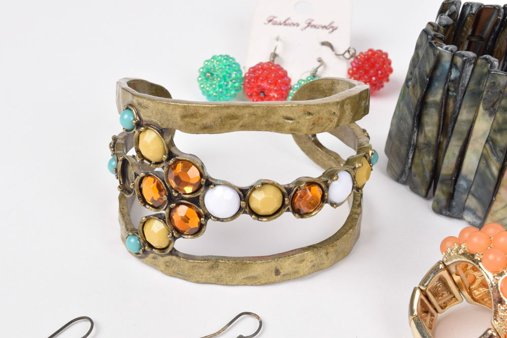 Collection of Costume Jewelry Including a Carved Shell Stretch Bracelet