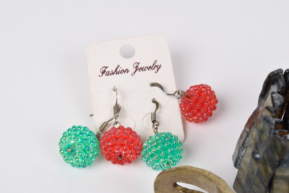 Collection of Costume Jewelry Including a Carved Shell Stretch Bracelet