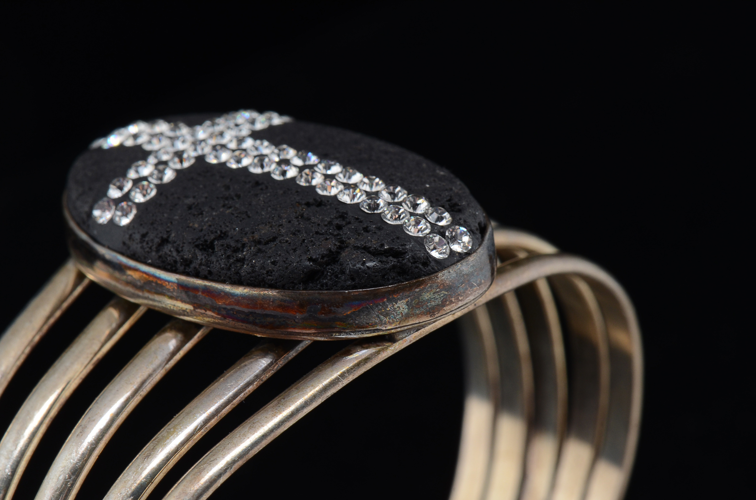 Sterling Silver Openwork Slit Cuff with Oval Bezel Set Lava Stone Encrusted with Crystal Rhinestones