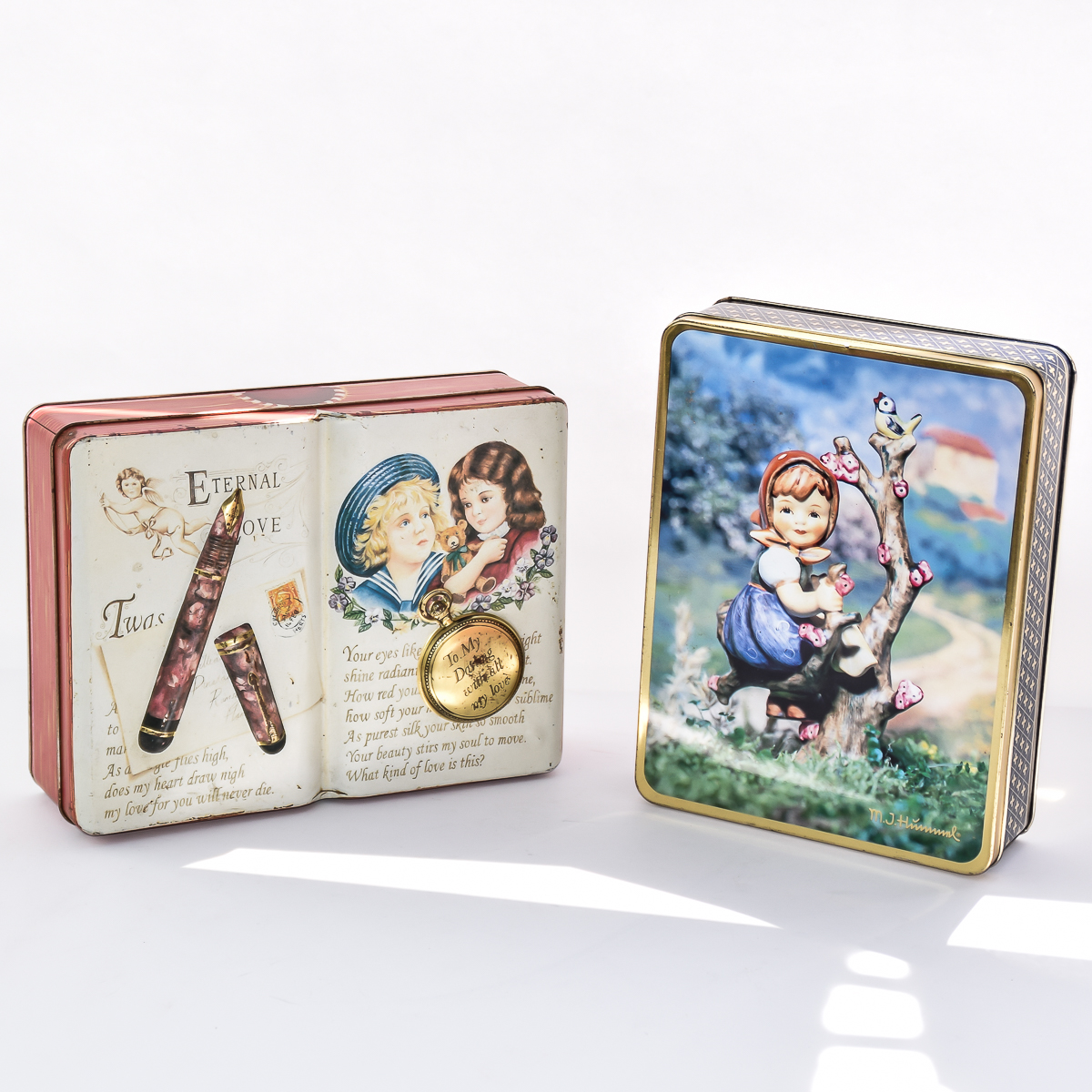 Pair of Vintage Hummel and Silver Crane Co. Tins