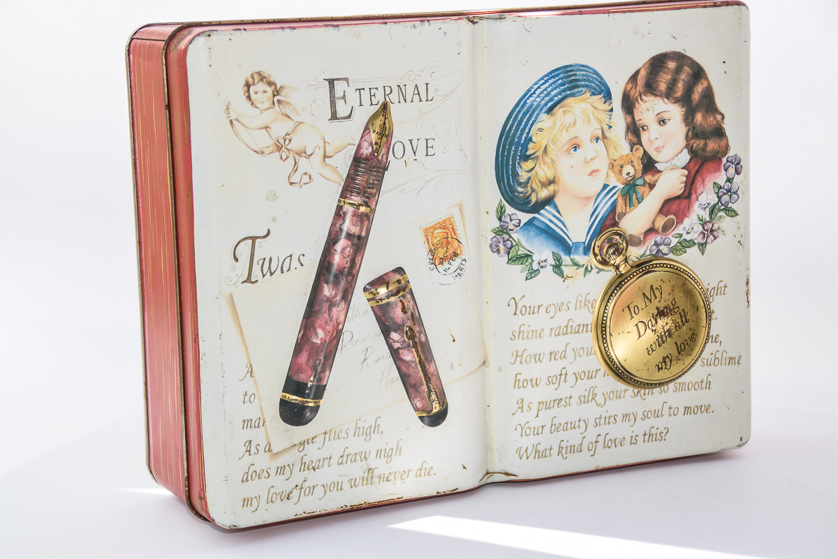 Pair of Vintage Hummel and Silver Crane Co. Tins