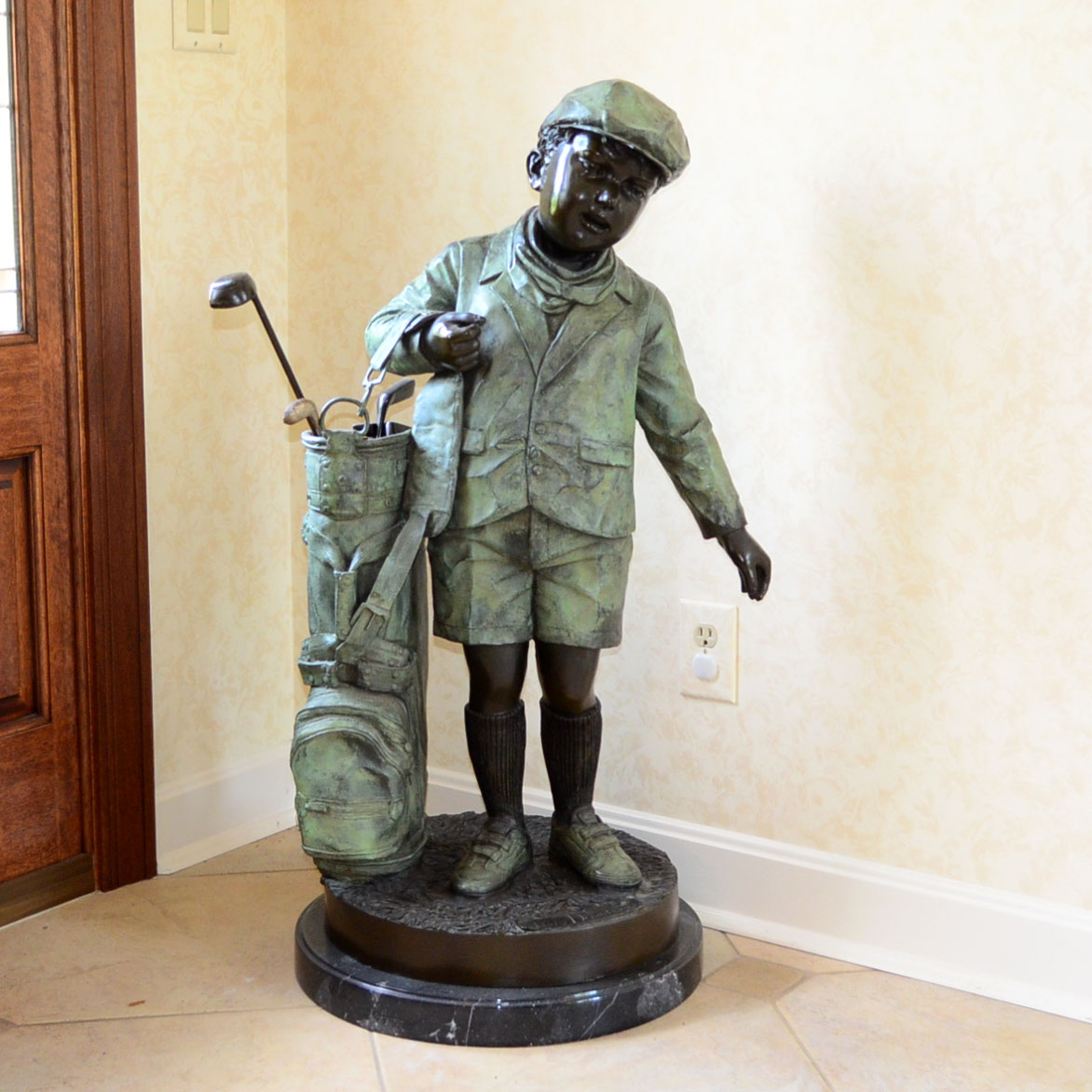 Metal Alloy Sculpture Of Young Golf Caddy