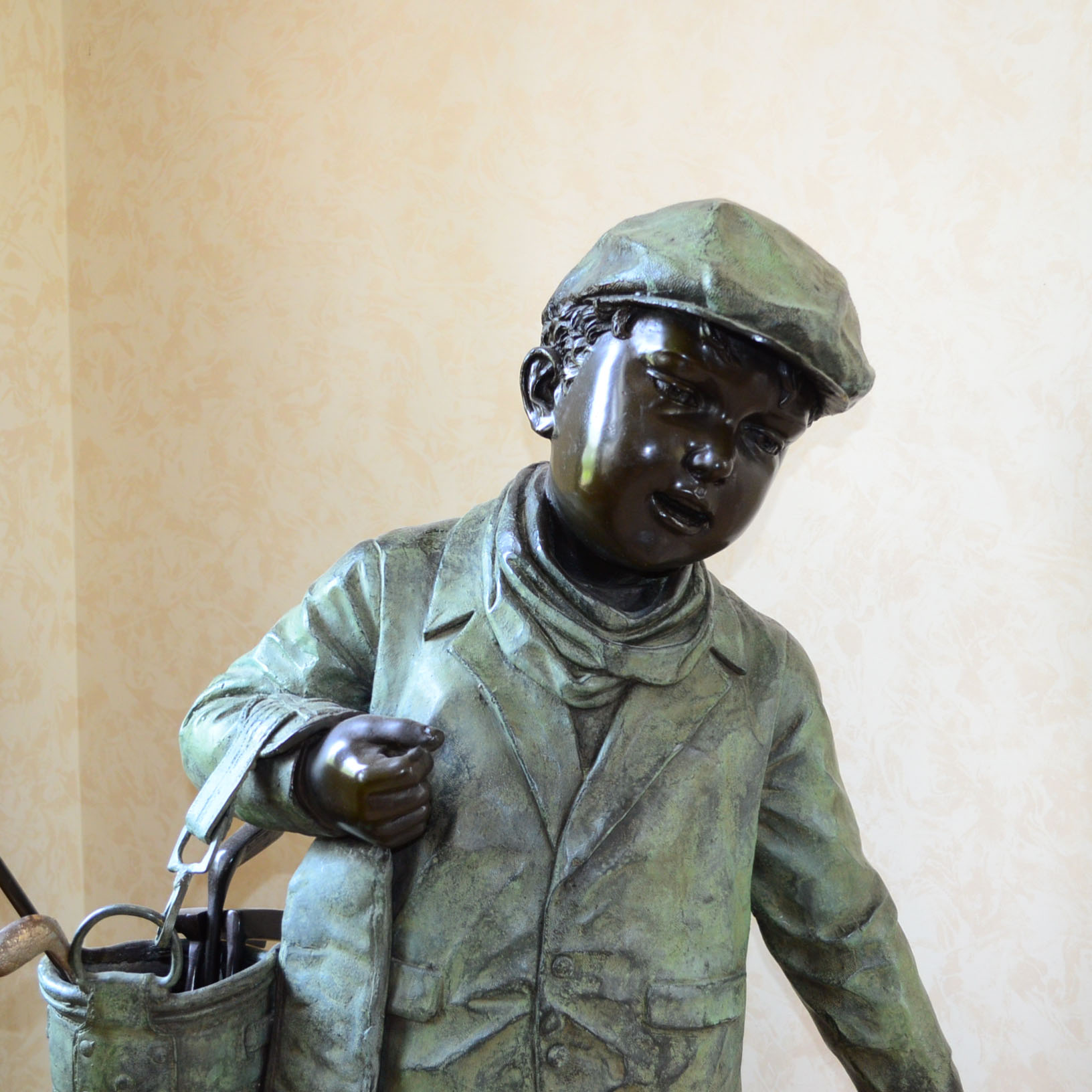 Metal Alloy Sculpture Of Young Golf Caddy