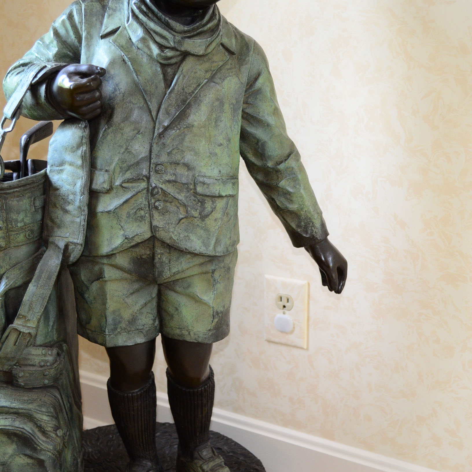 Metal Alloy Sculpture Of Young Golf Caddy