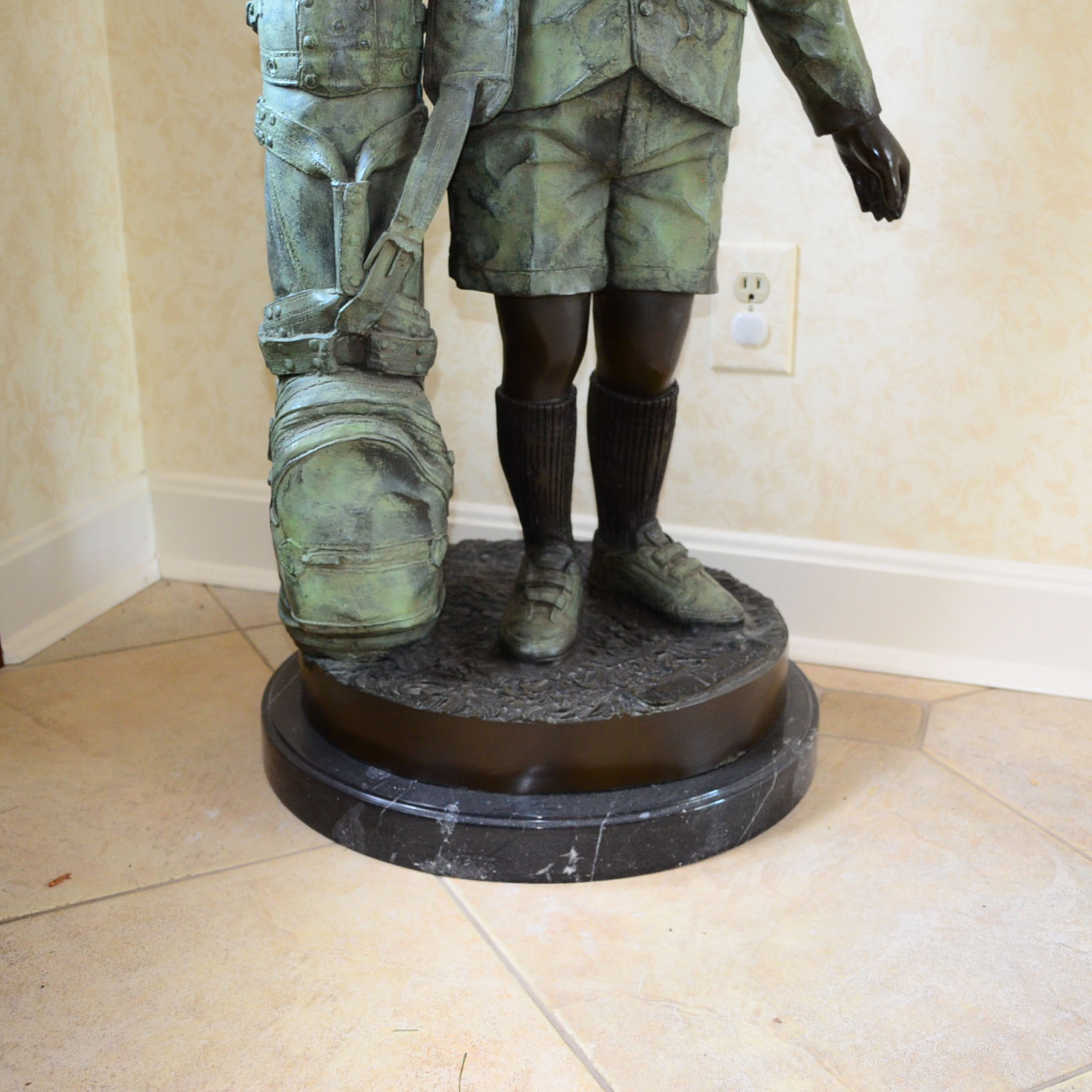 Metal Alloy Sculpture Of Young Golf Caddy