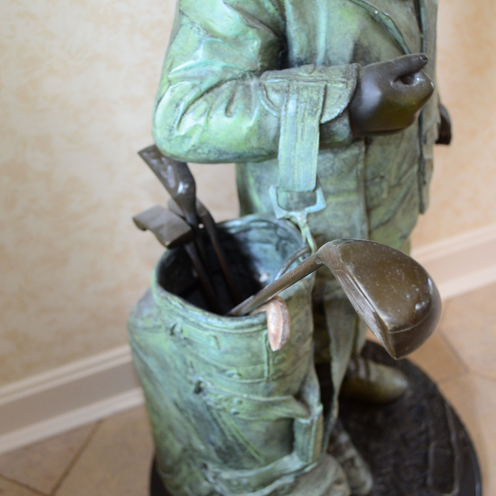 Metal Alloy Sculpture Of Young Golf Caddy