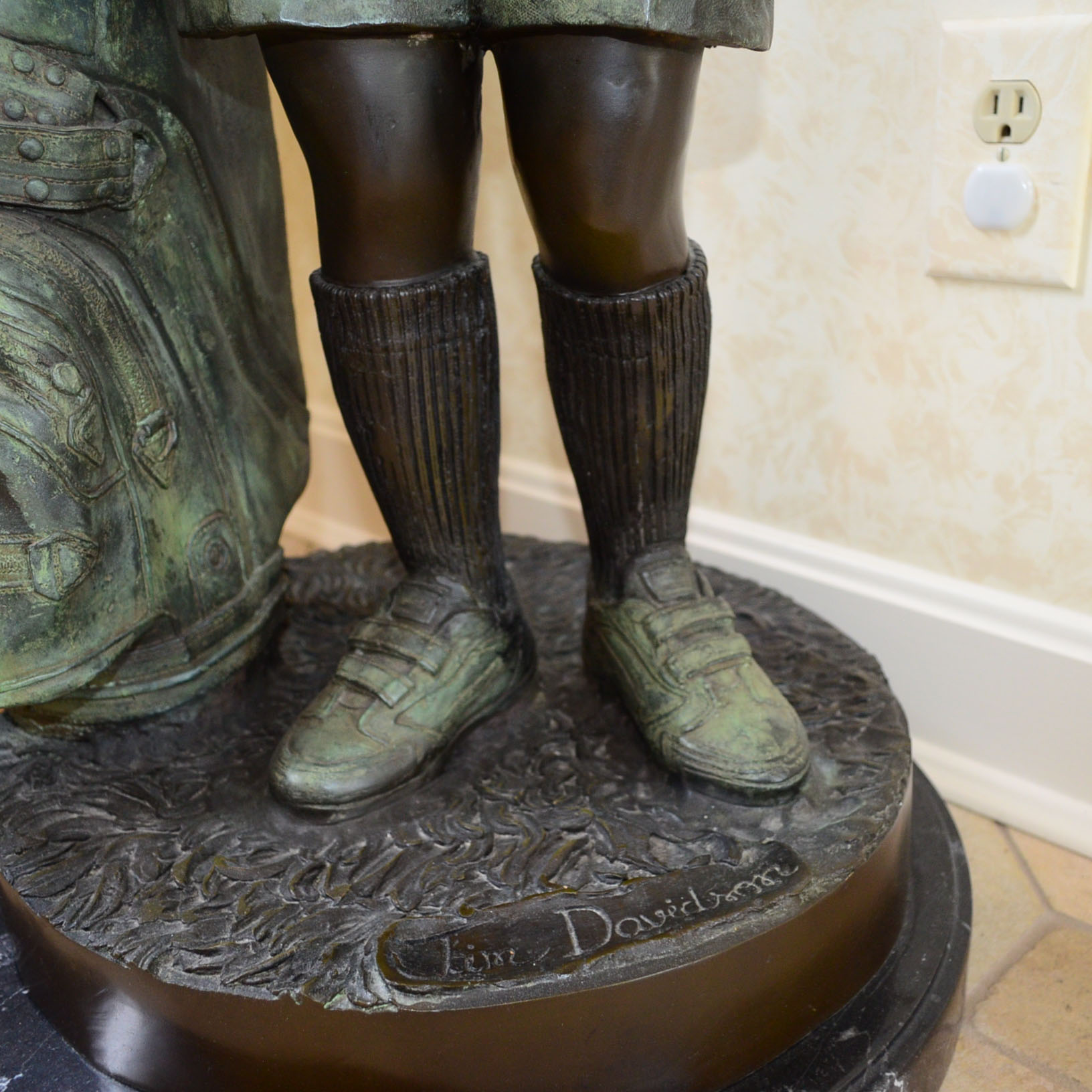 Metal Alloy Sculpture Of Young Golf Caddy