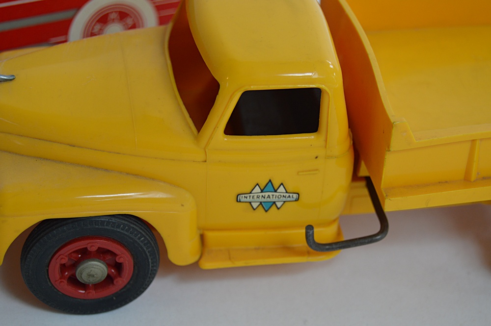 Three 1950s International Plastic Toy Trucks with Boxes