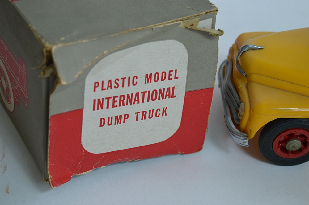 Three 1950s International Plastic Toy Trucks with Boxes