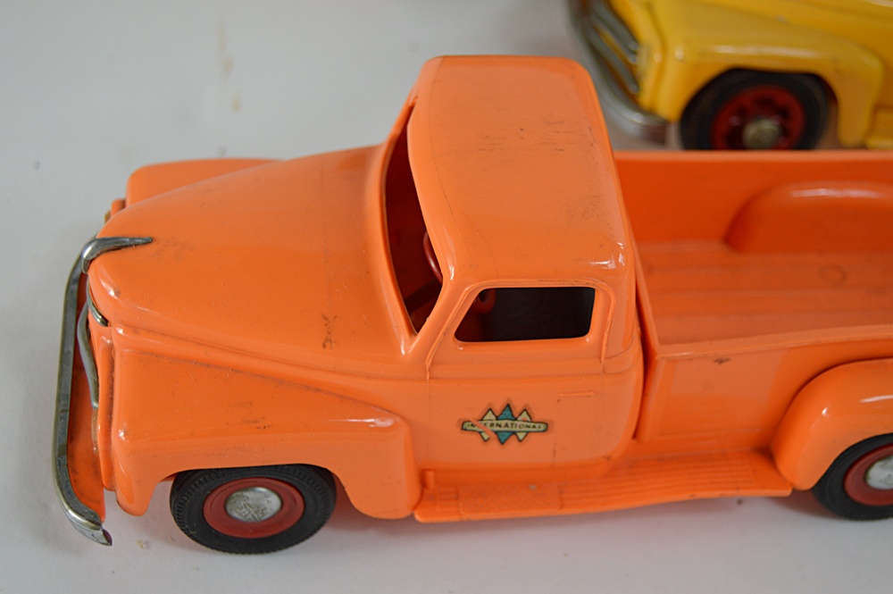 Three 1950s International Plastic Toy Trucks with Boxes