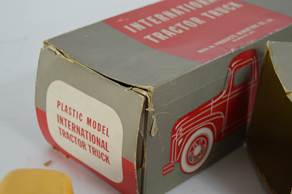 Three 1950s International Plastic Toy Trucks with Boxes