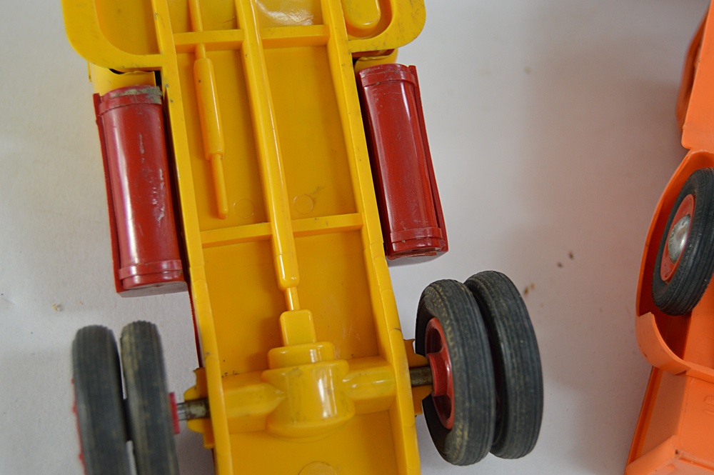 Three 1950s International Plastic Toy Trucks with Boxes