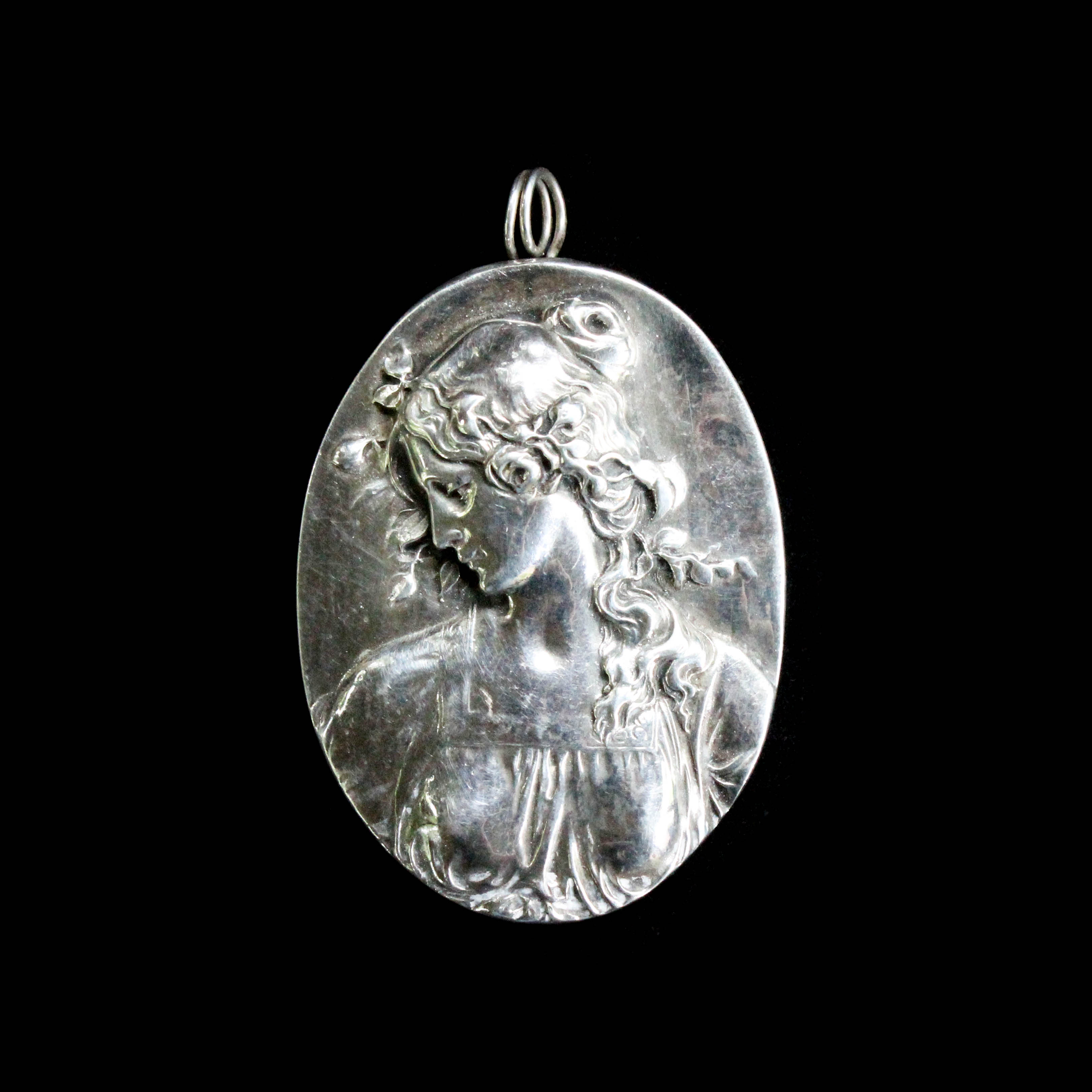 Silver Tone Pendant with Image of a Woman