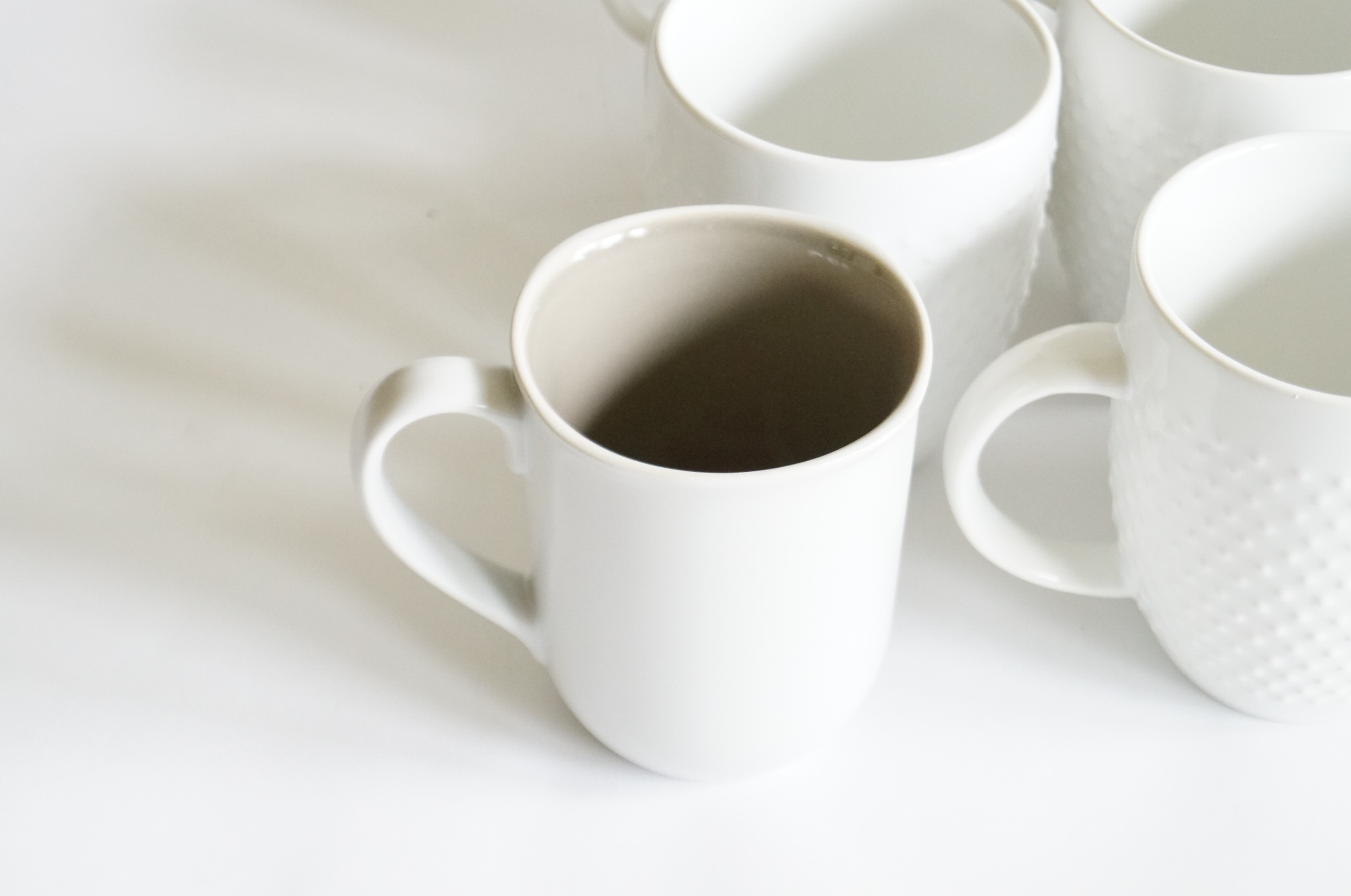 Assortment of Coffee Mugs and Drinking Glasses