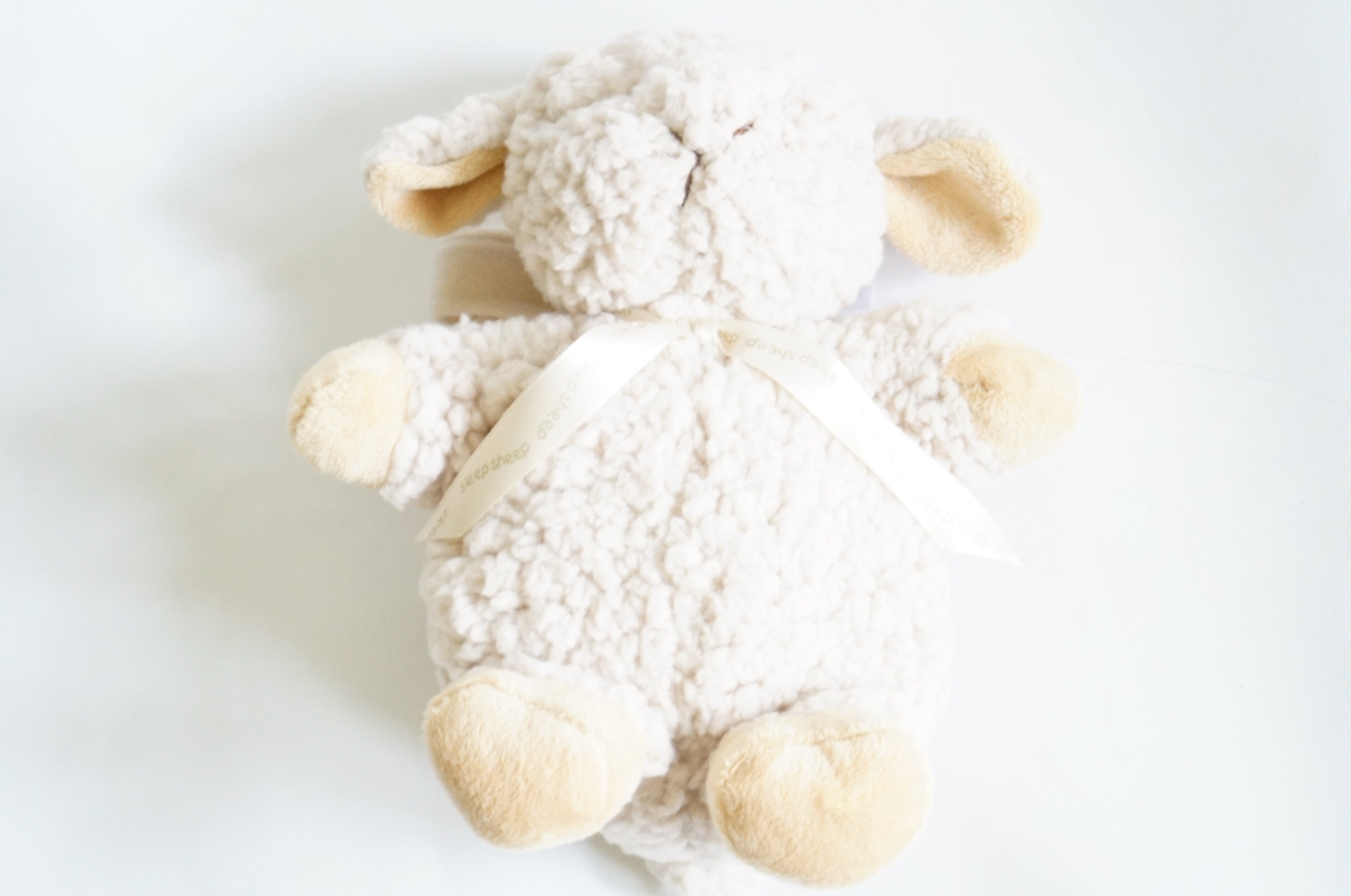 Basket of Stuffed Animals and Sleep Sheep