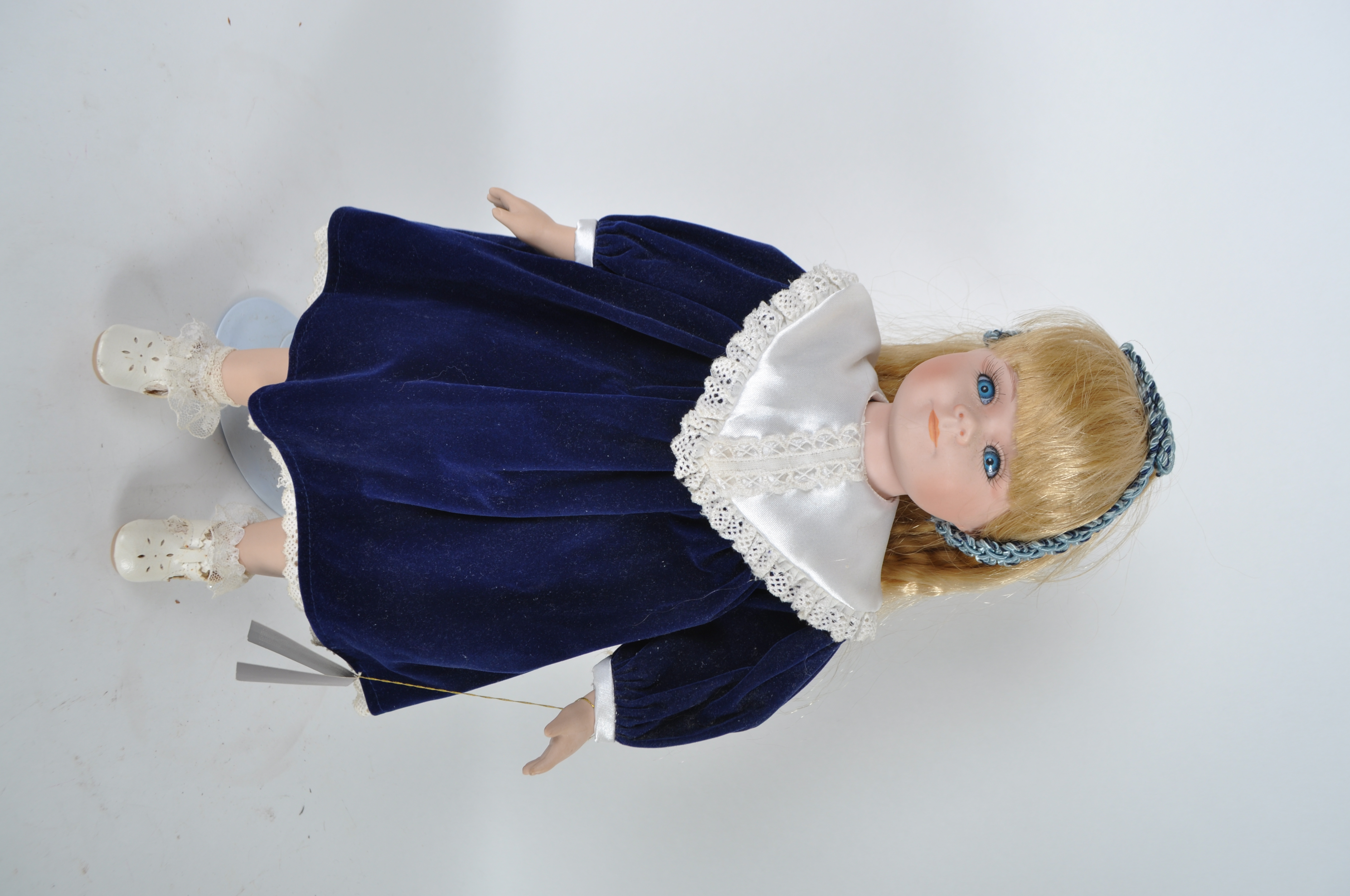 House of Lloyd Porcelain Doll in Blue Velvet Dress