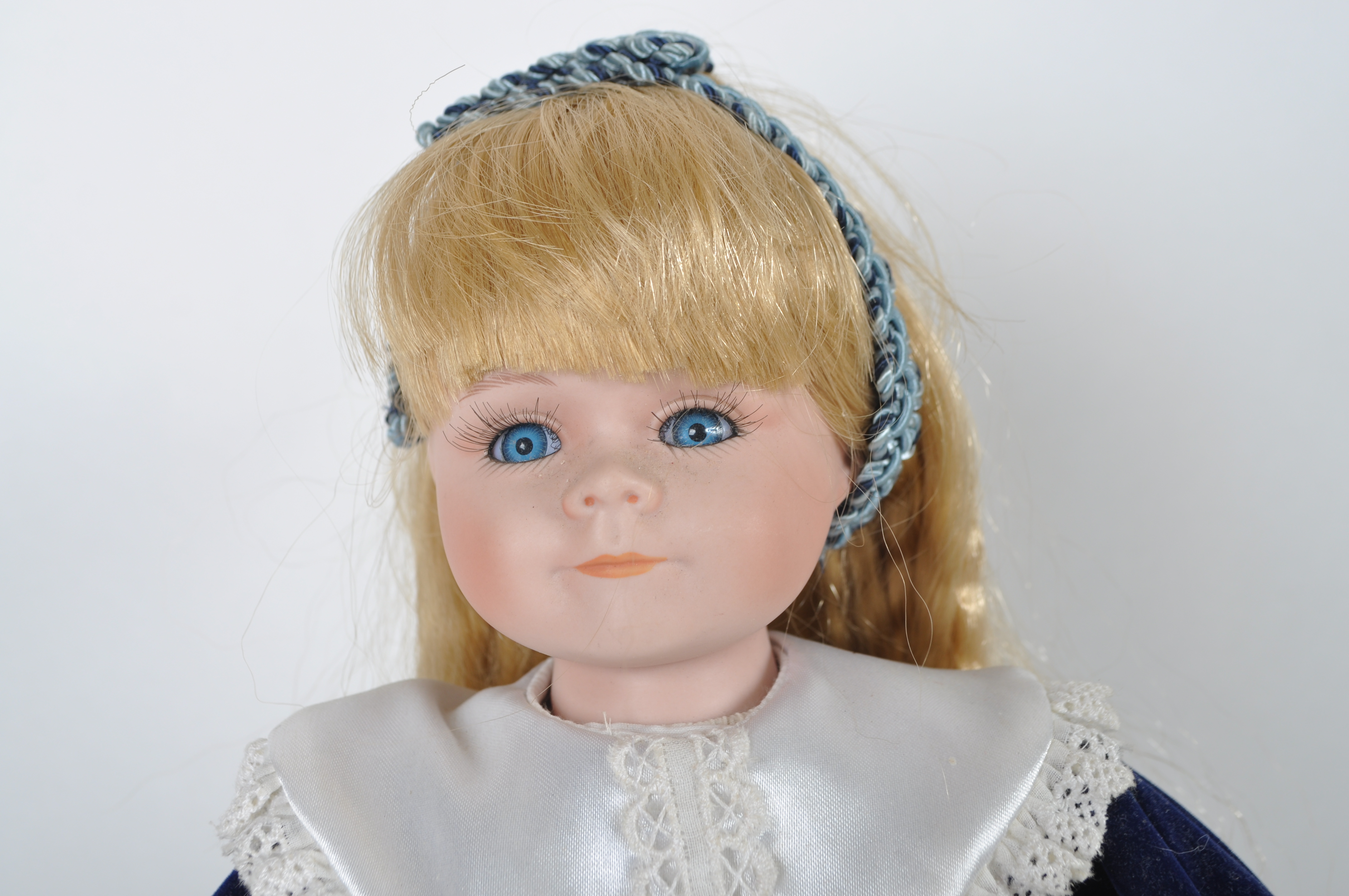 House of Lloyd Porcelain Doll in Blue Velvet Dress