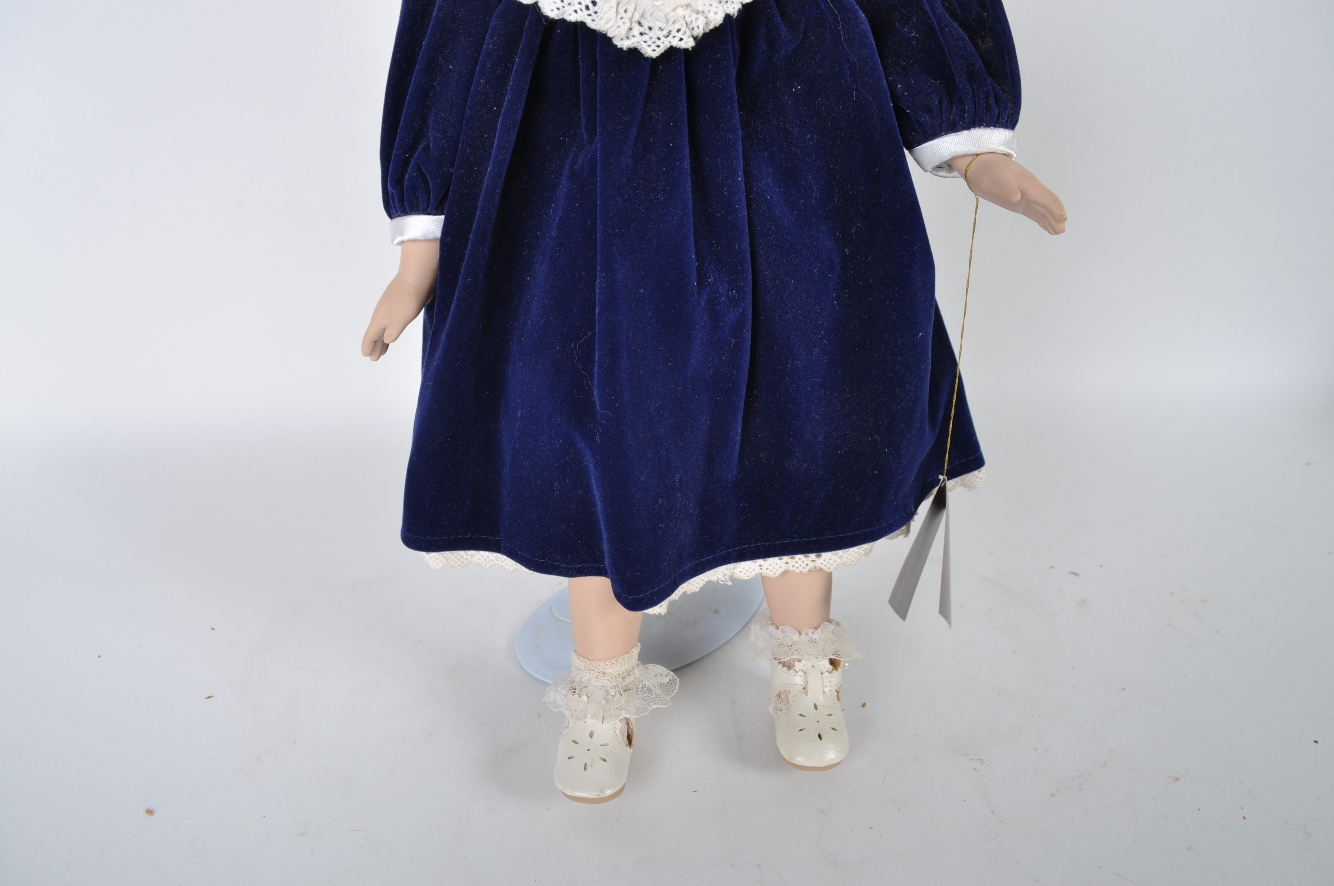 House of Lloyd Porcelain Doll in Blue Velvet Dress