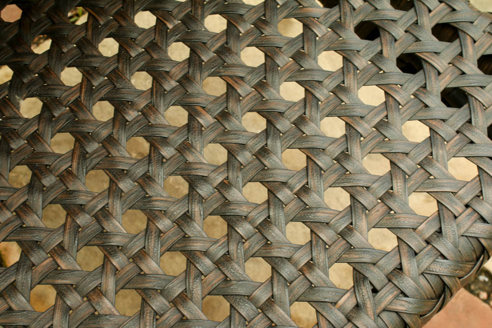 Four Wicker Wrapped Patio Armchairs and Glass Top Side Table