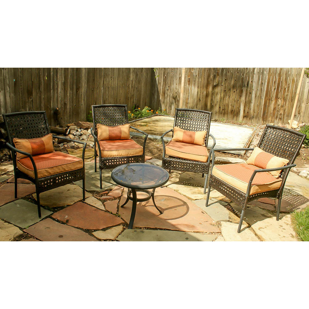 Four Wicker Wrapped Patio Armchairs and Glass Top Side Table