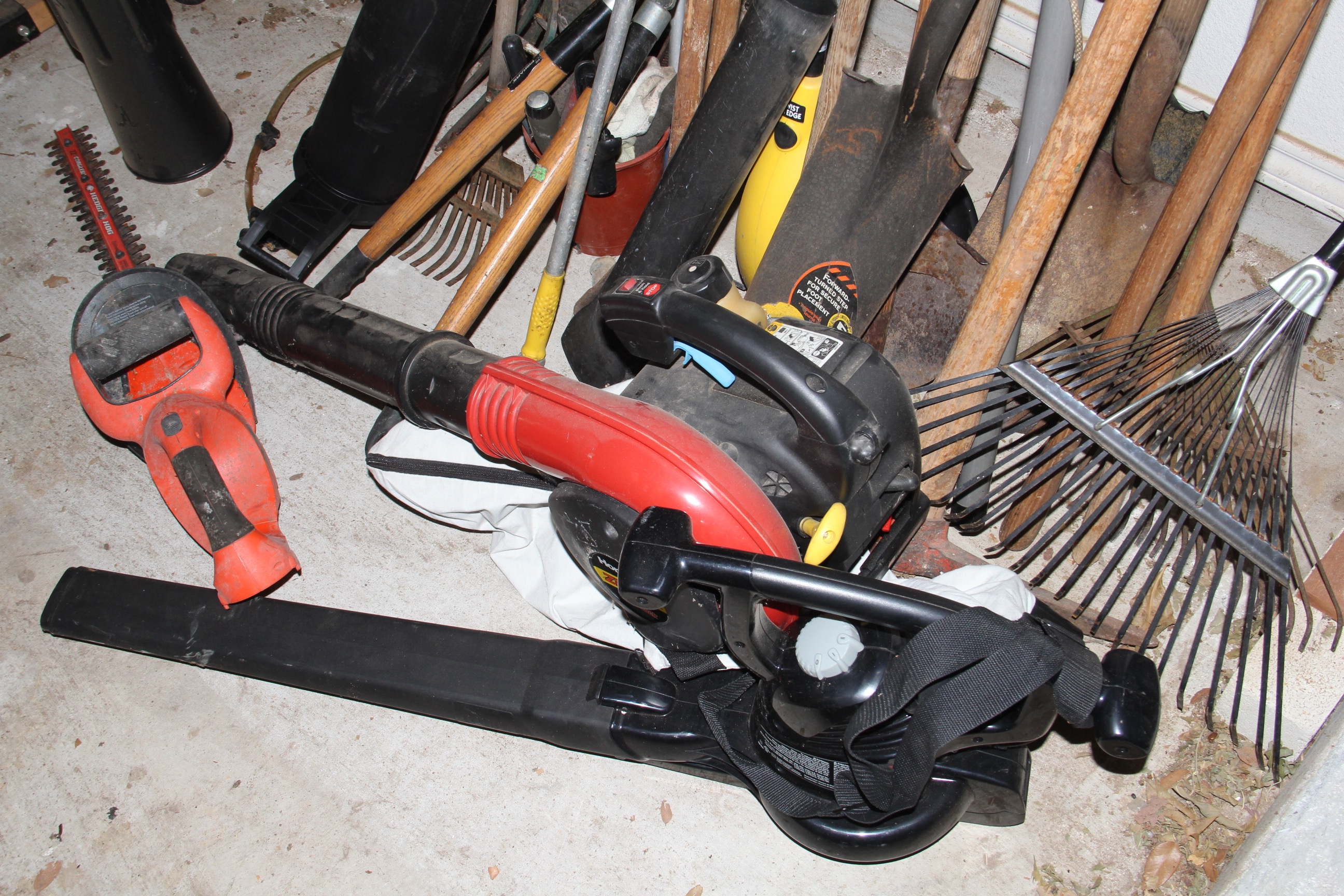 Large Group of Yard Tools and Ladder