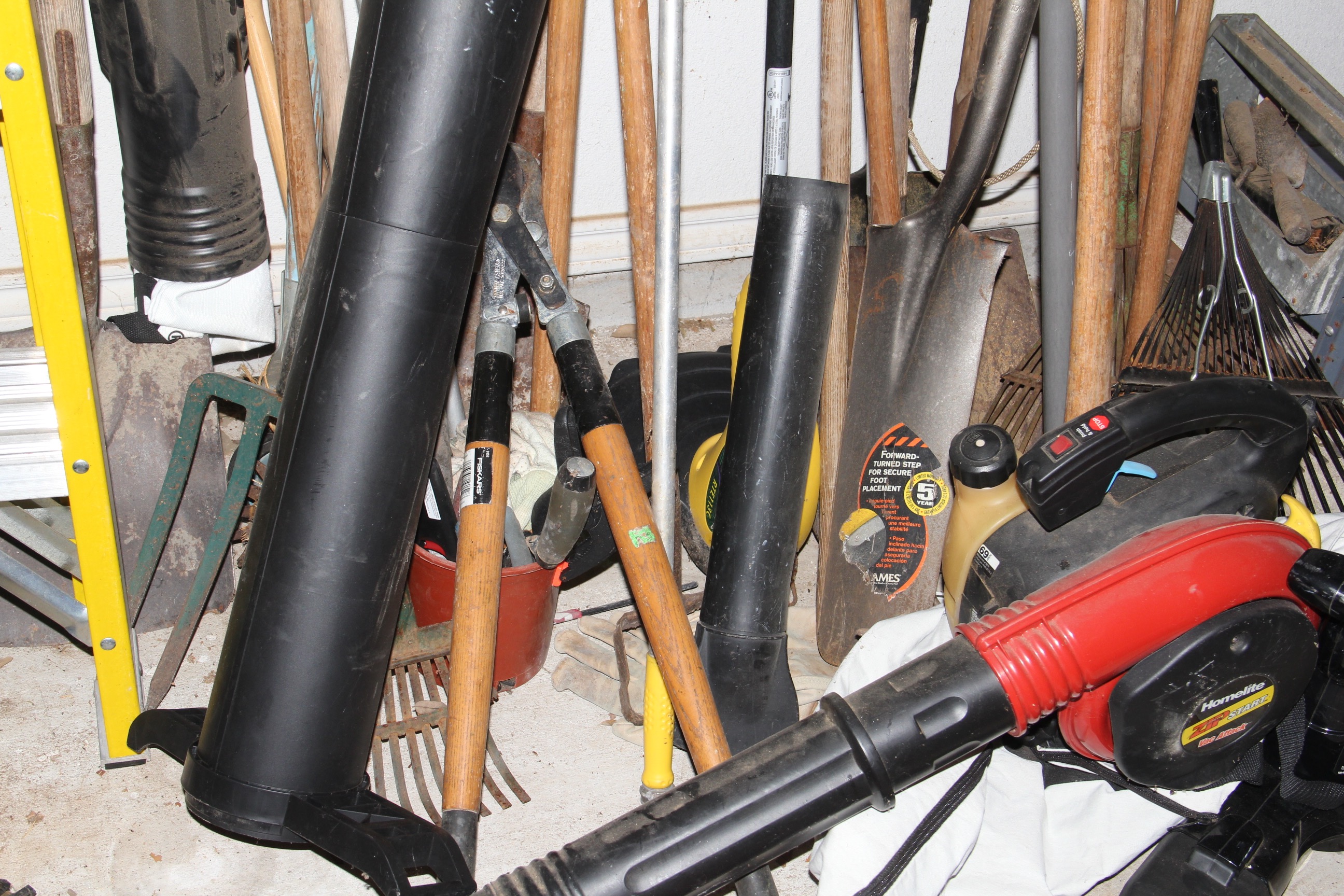 Large Group of Yard Tools and Ladder