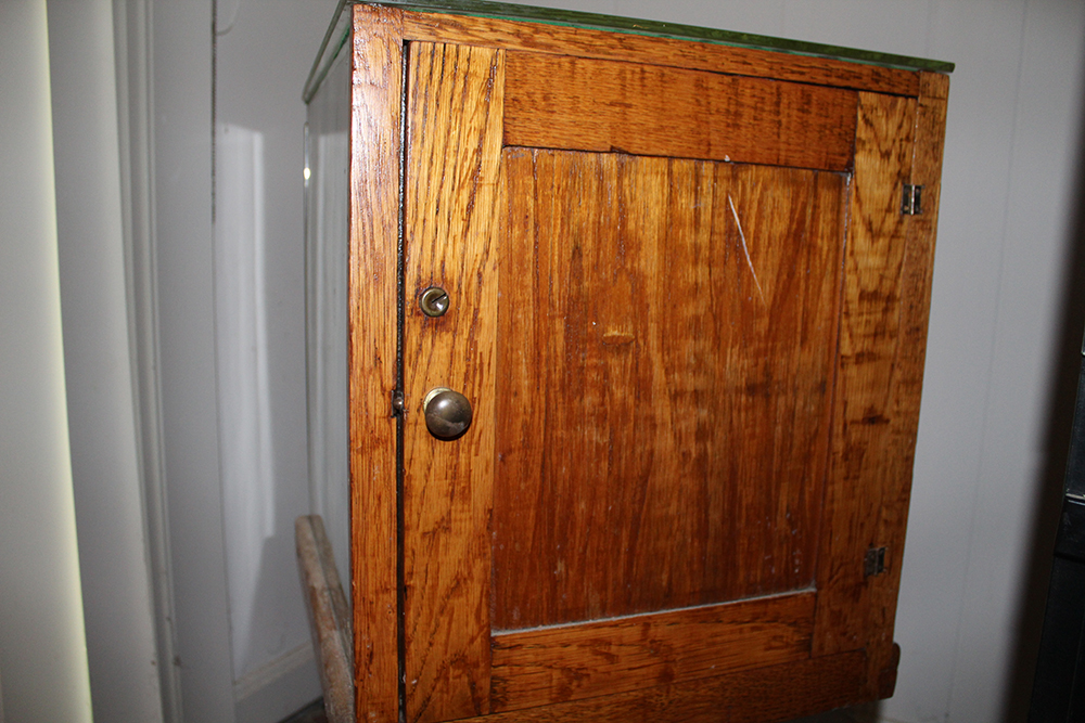 Antique Display Case Containing Children's Boots and Saddle