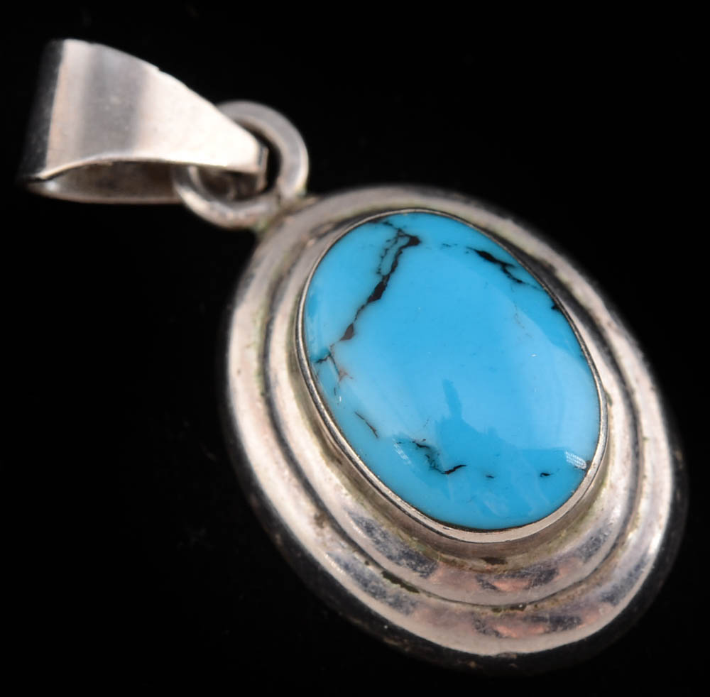 Four Southwestern Sterling Silver Pendants