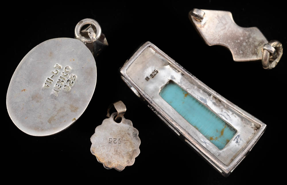 Four Southwestern Sterling Silver Pendants