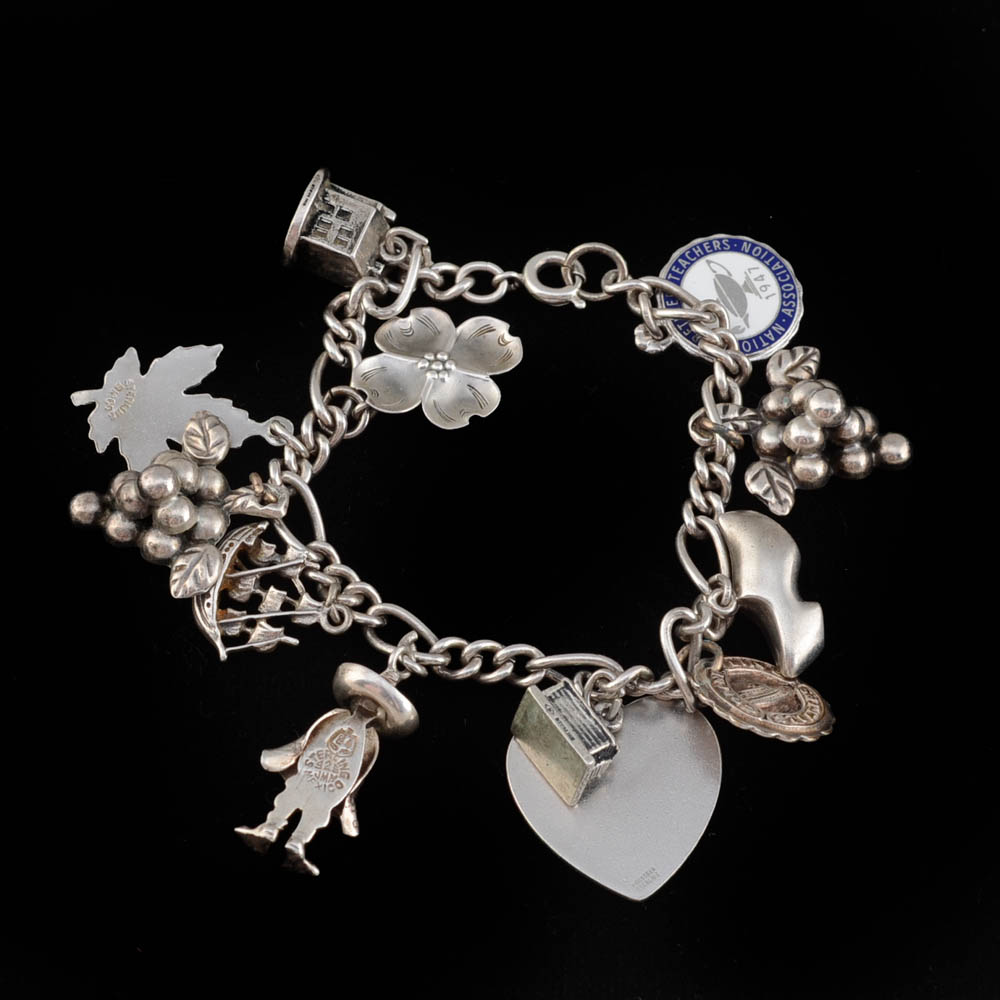 Sterling Charm Bracelet Including a Stuart Nye Dogwood Flower