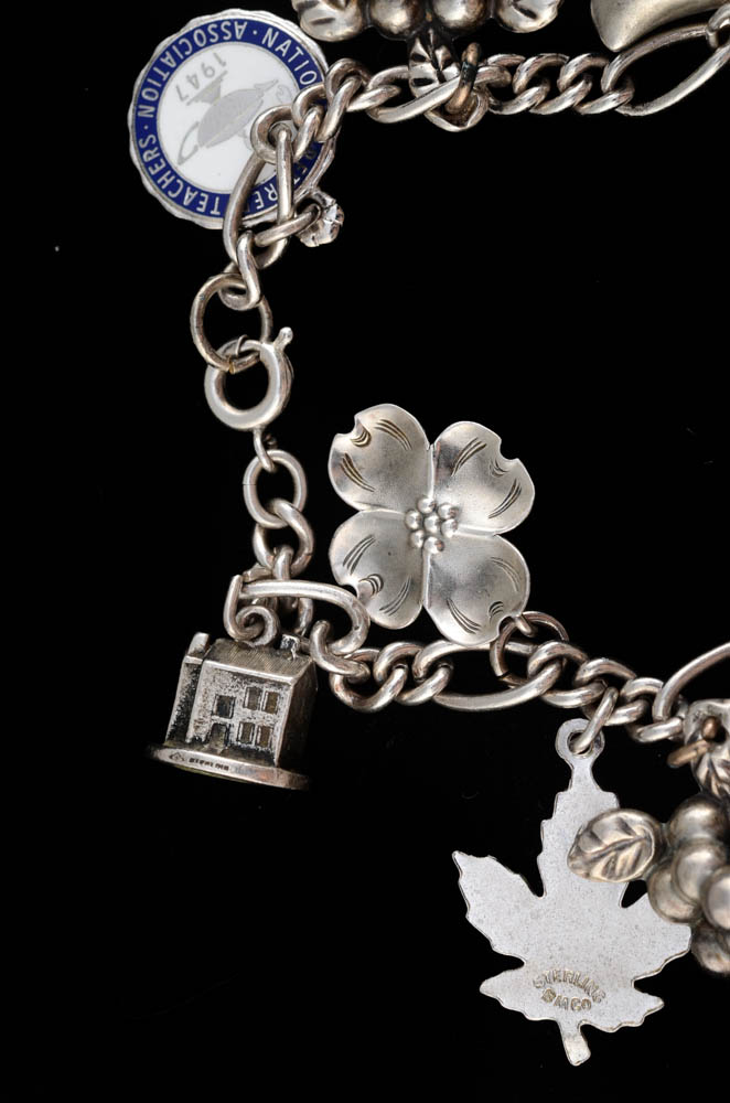 Sterling Charm Bracelet Including a Stuart Nye Dogwood Flower