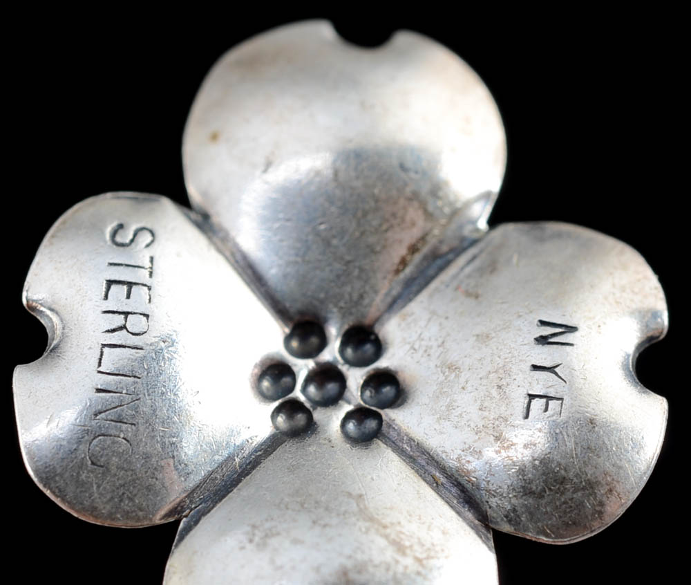 Sterling Charm Bracelet Including a Stuart Nye Dogwood Flower