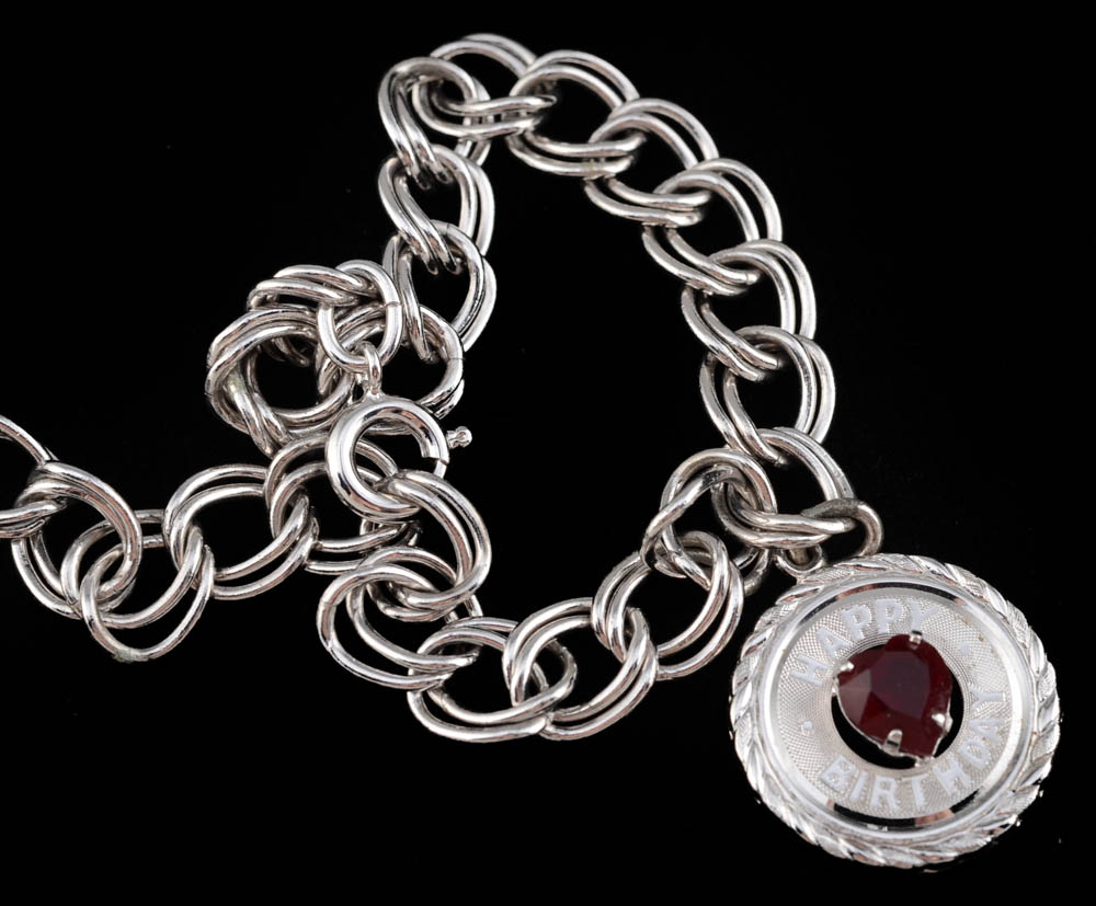 Two Charm Bracelets, Including Sterling Silver