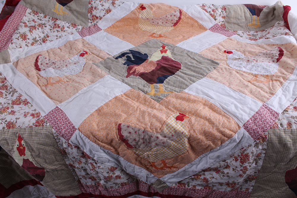 Two Hand Sewn Quilts with Large Central Motifs