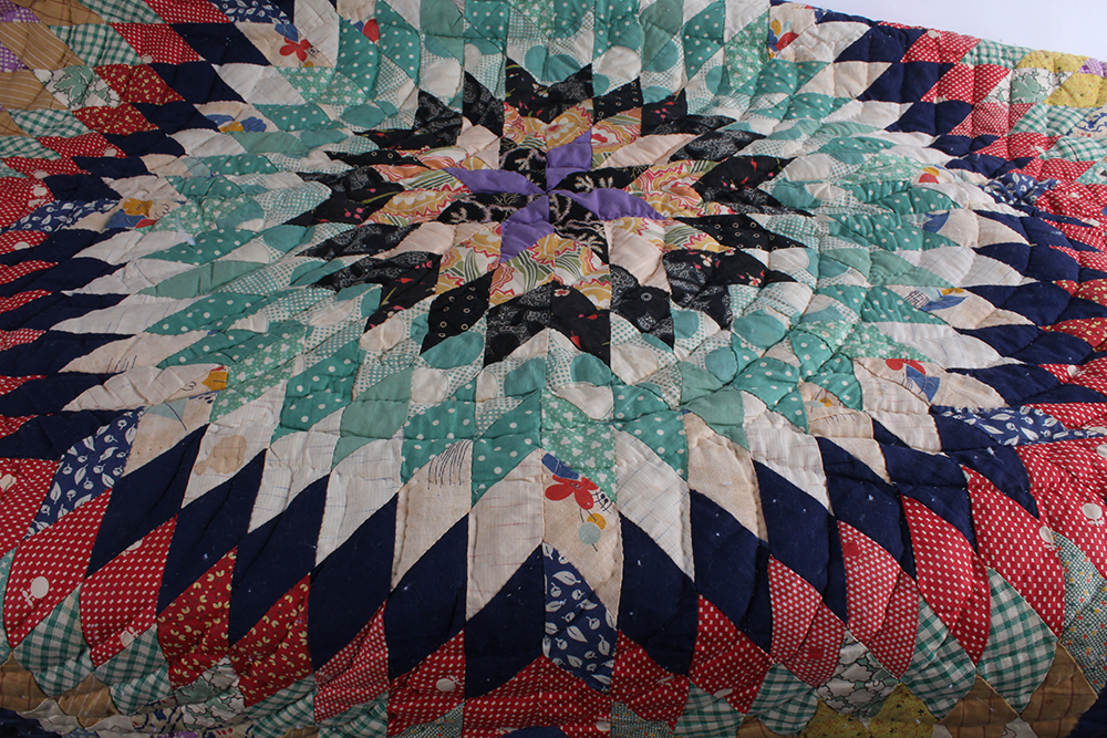 Two Hand Sewn Quilts with Large Central Motifs