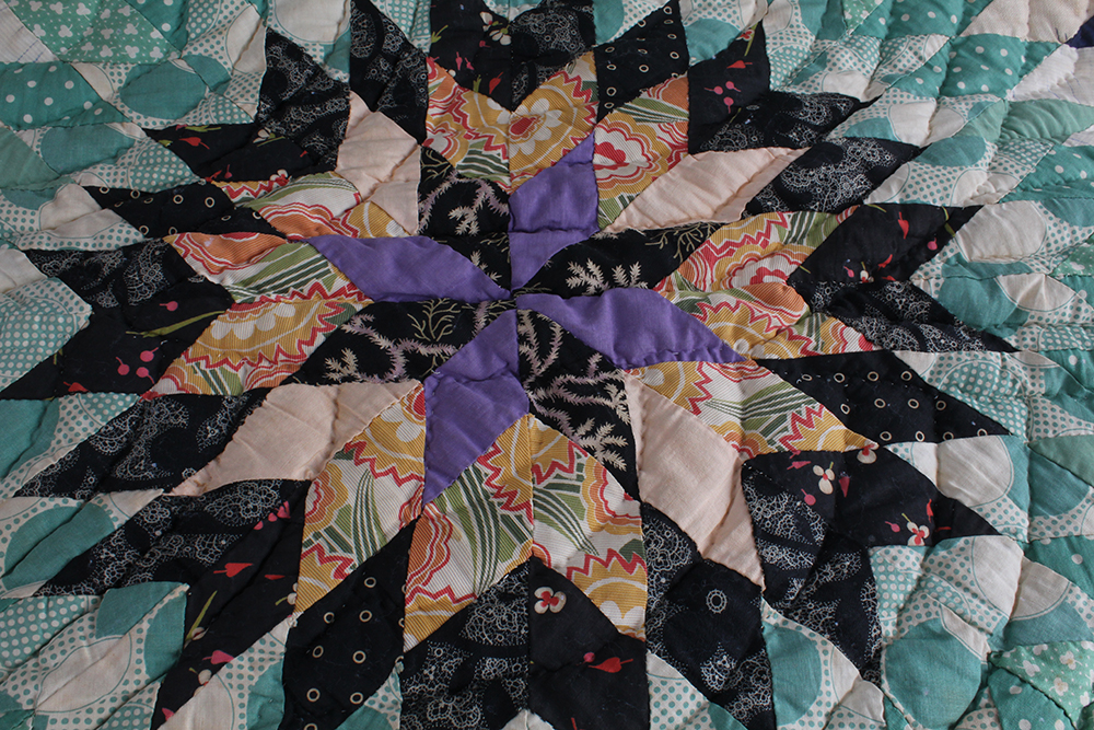 Two Hand Sewn Quilts with Large Central Motifs