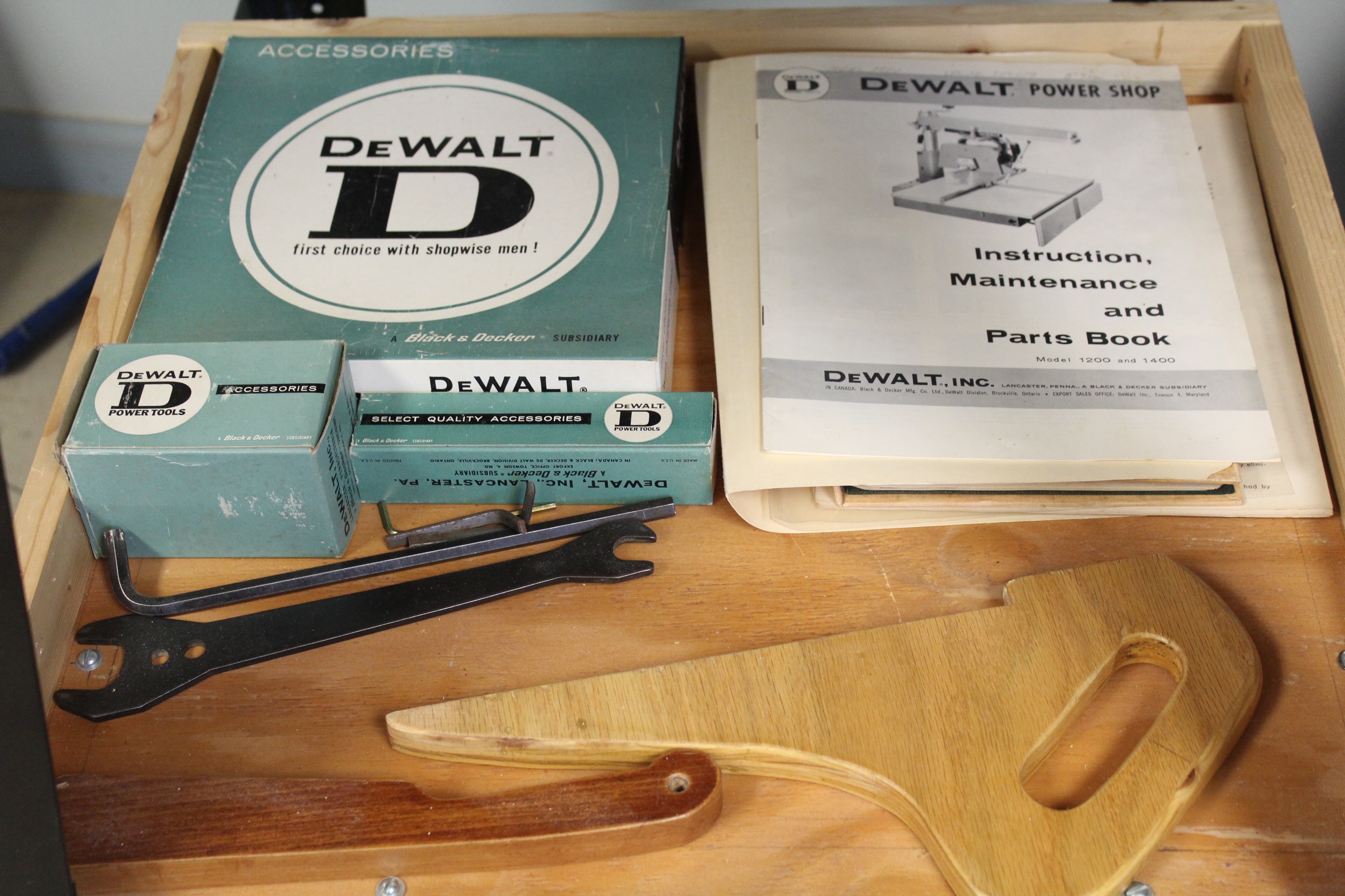 DeWalt Power Shop Radial Arm Saw on Stand and Wall of Blades