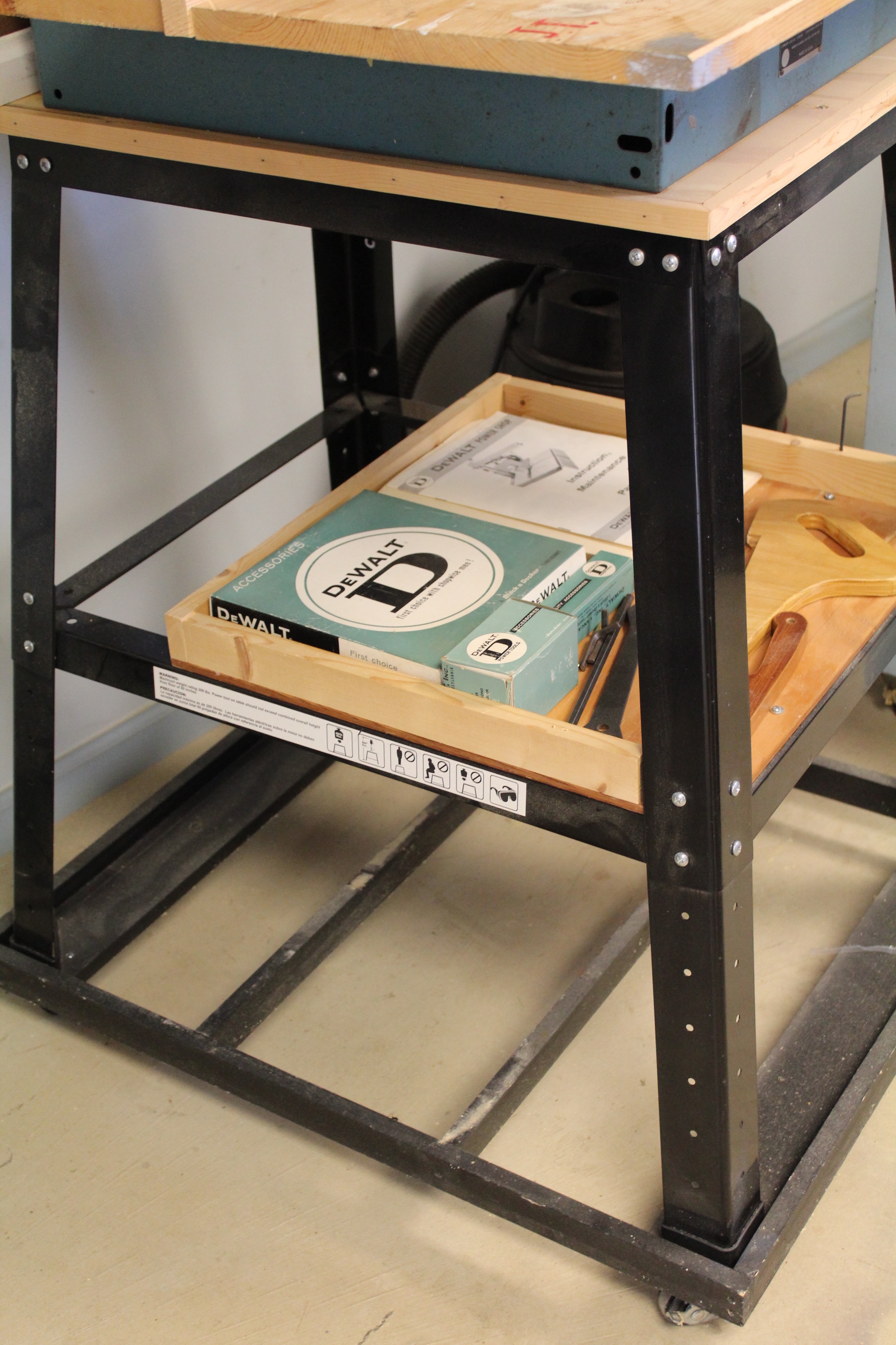 DeWalt Power Shop Radial Arm Saw on Stand and Wall of Blades