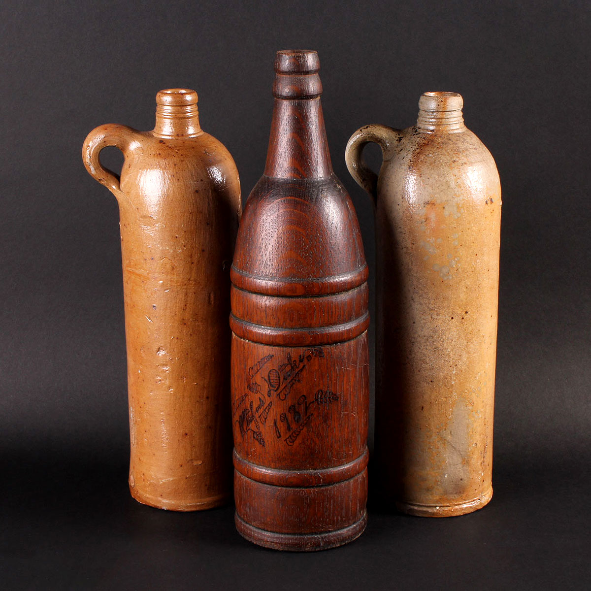 Three Vintage Alcohol Jugs